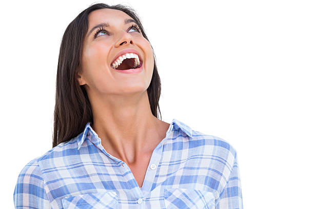 istock Young woman smiling and looking up 485738325