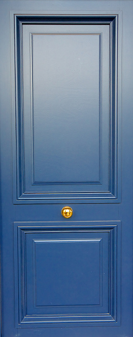 Blue, wooden modern door in Paris, house entrance, France