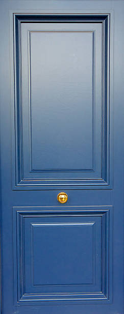 Blue, wooden modern door in Paris, house entrance, France Blue, wooden modern door in Paris, house entrance, France blue front door stock pictures, royalty-free photos & images