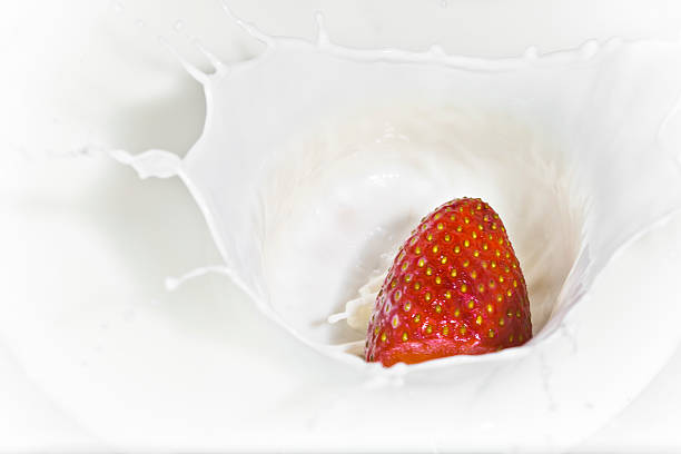 istock The strawberry falling in milk 485740488