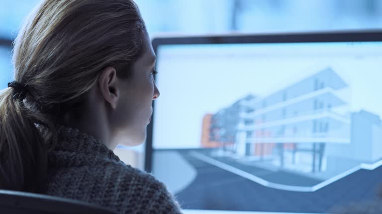 TU Female architect working on a virtual model