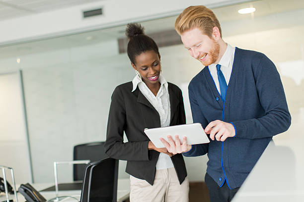 istock Young couple in the office 485742168