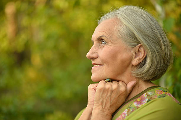 istock Senior woman in summer park 485742326