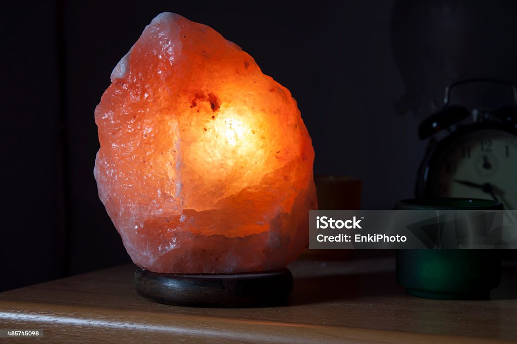 The salt rock lamp A lamp made with an Himalayan salt rock turned on. Electric Lamp Stock Photo