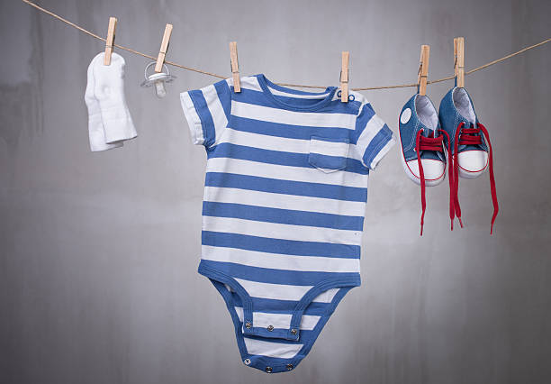 istock Baby clothes hanging on the clothesline 485745178