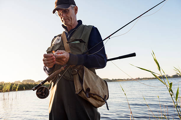 istock Candid Portrait of Fly Fisherman Tying a Fly 485746292