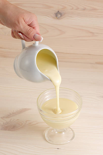 istock Pouring condensed milk in a bowl 485747166