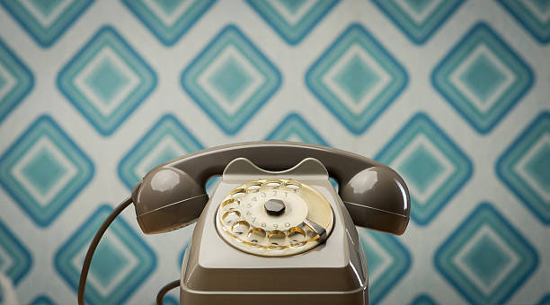 istock Vintage telephone on diamond wallpaper 485750702
