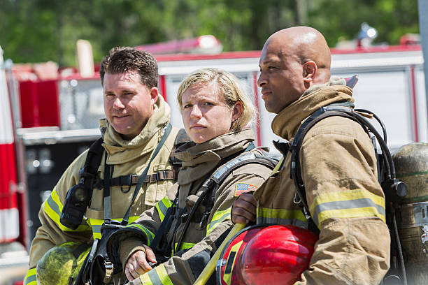 istock Female firefighter with two male colleagues 485751112