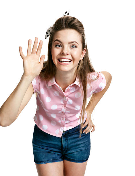 istock Smiling girl showing her hand up, greeting gesture 485751574