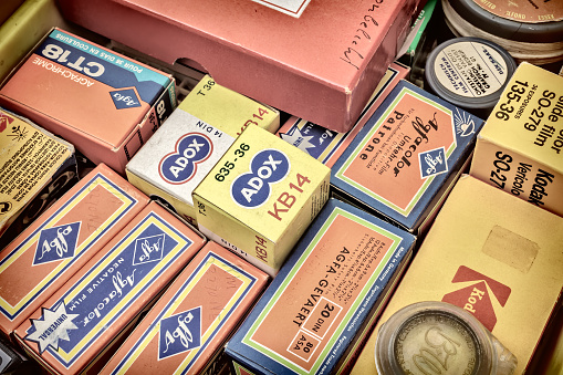 Doesburg, The Netherlands - August 23, 2015: Retro styled image of old color slide film packs on a flee market in Doesburg, The Netherlands