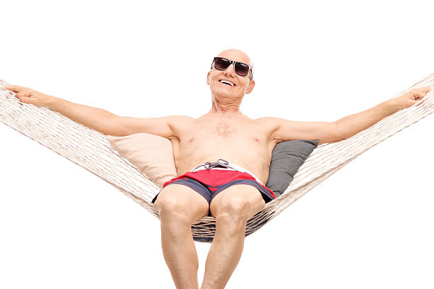 istock Relaxed senior man lying on a hammock 485756334