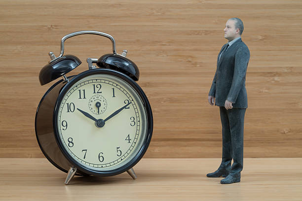 istock Businessman Action Figure with Twin Bell Alarm Clock 485760676