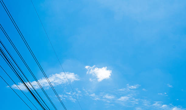 istock clouds in the blue sky and small electric line 485762840