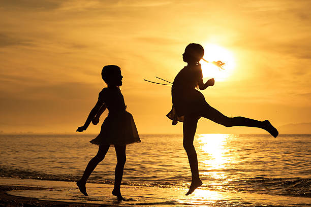 istock Happy children playing on the beach 485765544