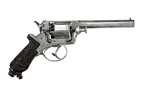 Antique vintage revolver decorative ornate isolated on white