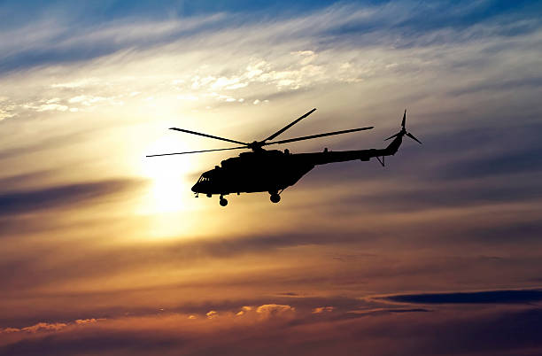 istock Picture of helicopter at sunset. 485767112