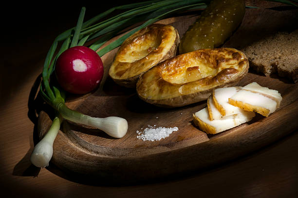 istock Baked potato, salted lard and onion, light brush 485767752