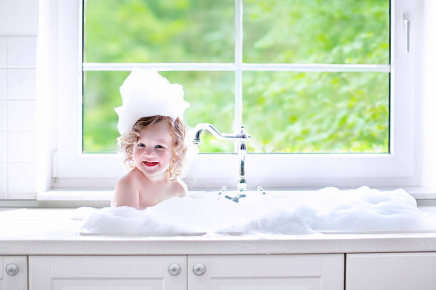 istock Baby girl taking bath with foam 485767904