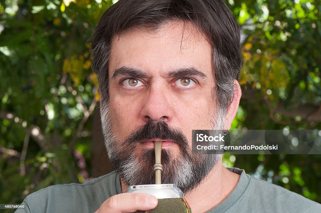 Drinking Yerba Mate Middle-aged man with a beard drinking Yerba Mate Brazil Stock Photo