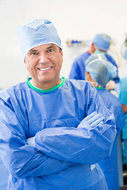 istock Mature surgeon smiling in hospital operating room before surgery 485771750