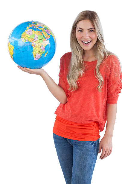 istock Cheerful woman holding globe 485772375