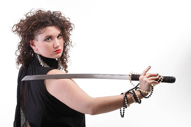 istock piercing woman curly girl and sword 485772797