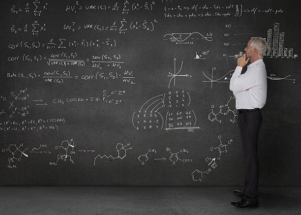 istock Elegant businessman looking at maths equations 485773385