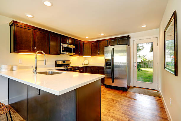 istock Chocolate color kitchen room with door to backyard 485774015