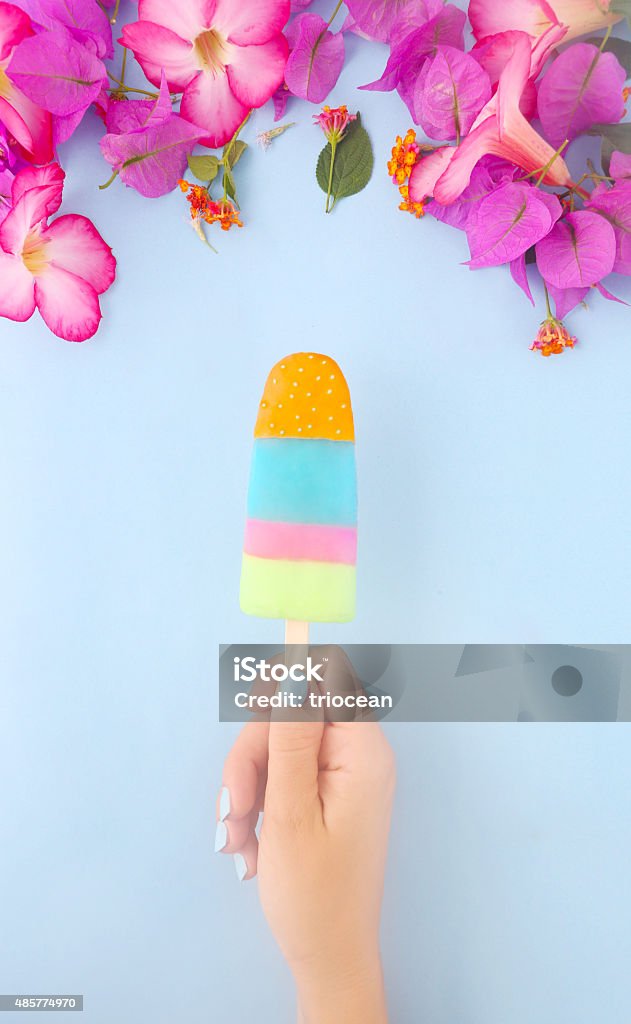 Happy summer Woman hand holding colorful popsicle Ice Cream Stock Photo