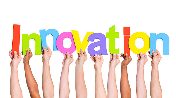 istock Multi-Ethnic Group Of People Holding The Word Innovation 485775185