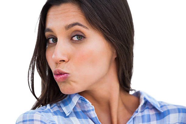 istock Brunette making kissing face at camera 485775245