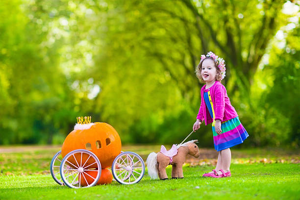 istock Little girl at pumpkin patch at Halloween 485775422
