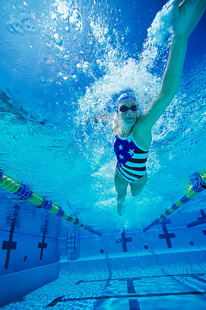 istock Young Woman Swimming in Pool 485776161