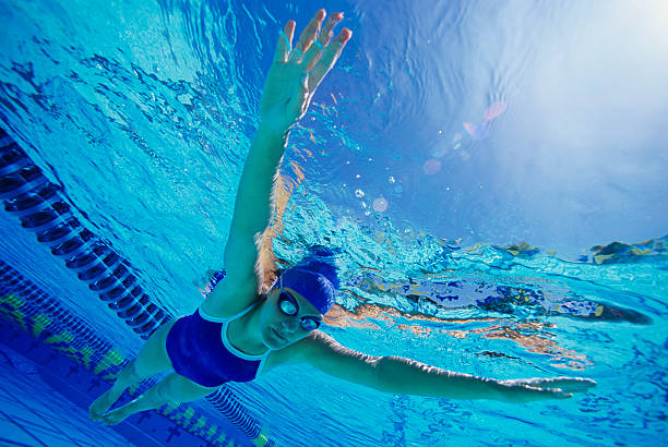 istock Young Woman Swimming in Pool 485776165