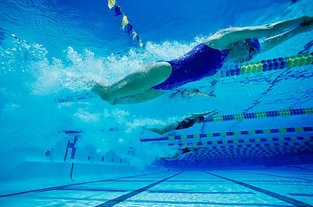 Photo of Young Woman Swimming in Pool