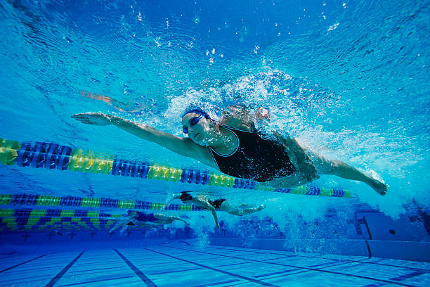 istock Young Woman Swimming in Pool 485776171