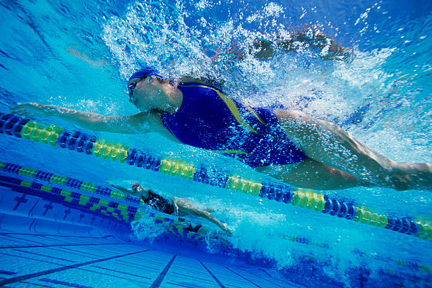 istock Young Woman Swimming in Pool 485776179