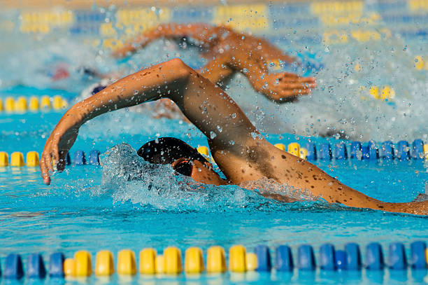 Swimmers Racing stock photo