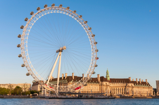 London, United Kingdom - May 10, 2011: London Eye in afternoon sun. The giant Ferris wheel is 135 meters tall and the wheel has a diameter of 120 meters.