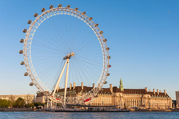 London Eye in afternoon sun London, United Kingdom - May 10, 2011: London Eye in afternoon sun. The giant Ferris wheel is 135 meters tall and the wheel has a diameter of 120 meters. famous sight stock pictures, royalty-free photos & images