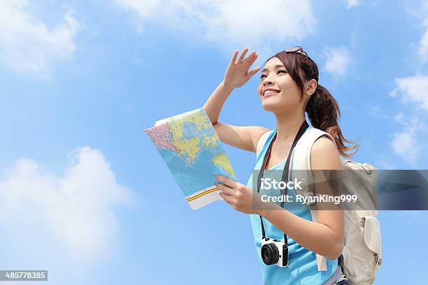 Happy Travel Woman Look Map Stock Photo - Download Image Now - Guide - Occupation, Japanese Ethnicity, Travel