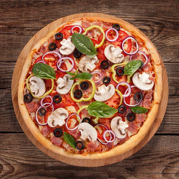 istock Italian delicious pizza with mushrooms and ham 485778950