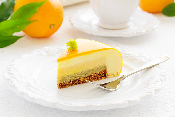 istock Cake with orange mousse and almond krokantom 485780836