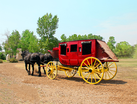 An old Red stagecoach and blue sky at Denver, Colorado.