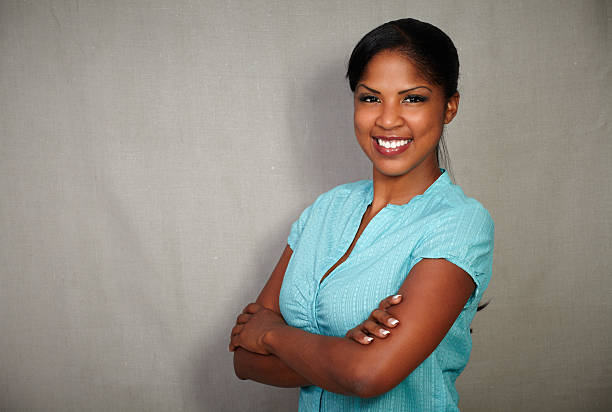 istock Good-looking african lady smiling at the camera 485787652