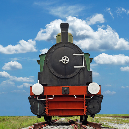 old steam engine locomotive train with beautiful sky background