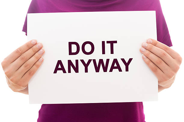 Do it anyway Girl holding white paper sheet with text Do it anyway anyway stock pictures, royalty-free photos & images