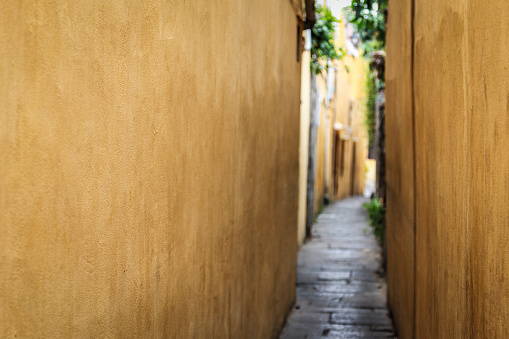 Alley with yellow walls in Hoi An, Vietnam - 2013