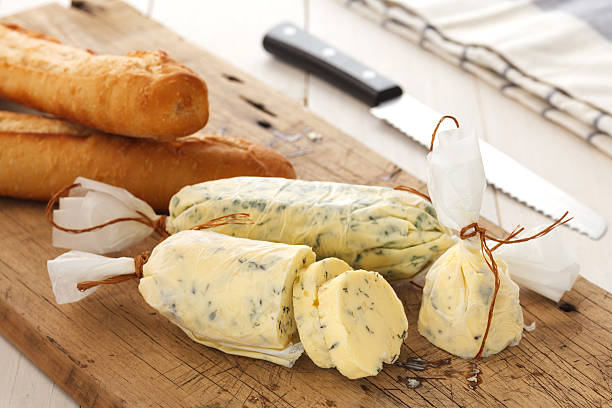 garlic bread compound butter herb baguette thyme rosemary coriander oregano garlic bread compound butter herb baguette thyme rosemary coriander oregano fresh chopped homemade italian food snack tasty french currency photos stock pictures, royalty-free photos & images